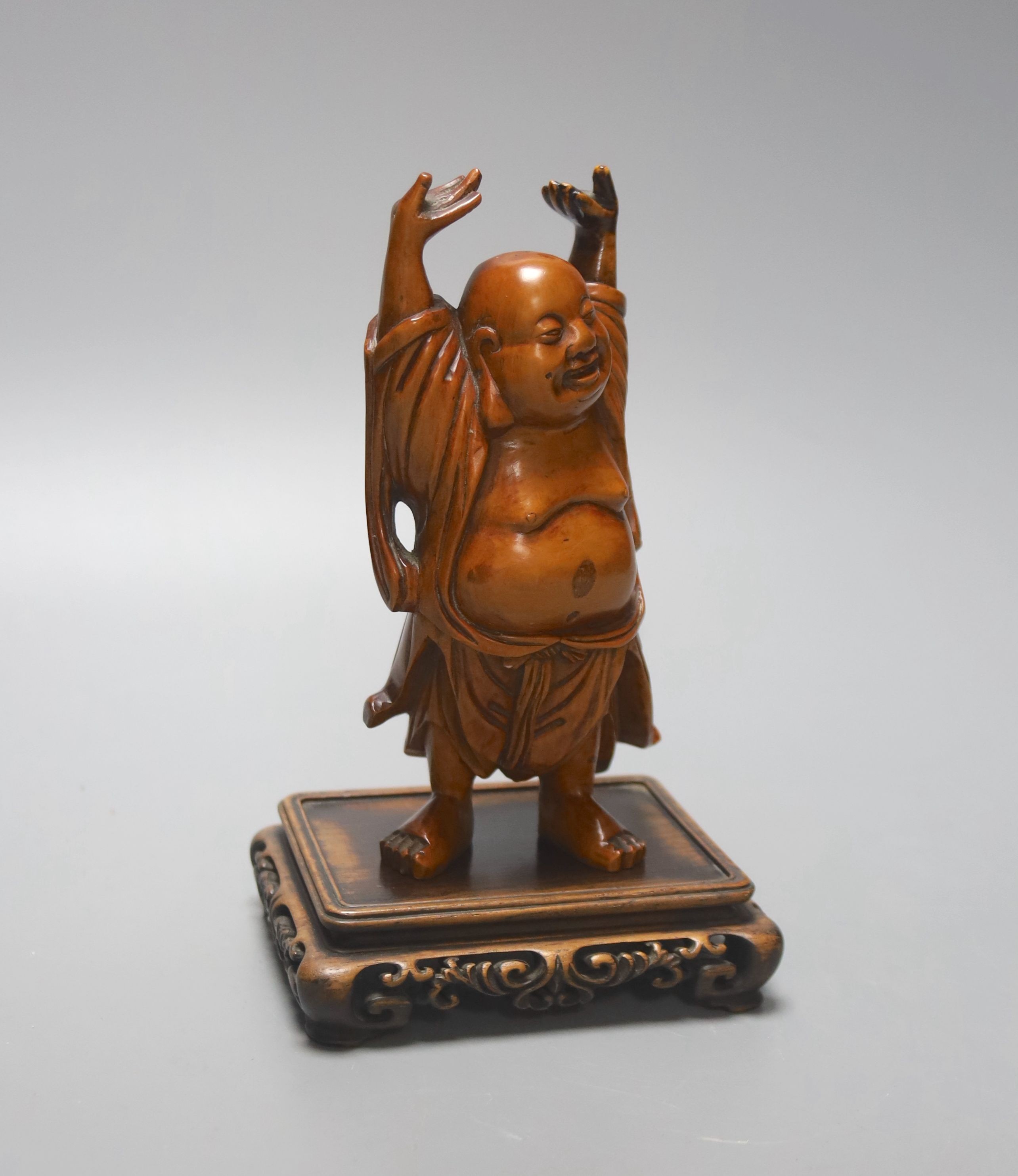 A Chinese boxwood figure of Budai standing, on a hardwood stand 14cm excl stand